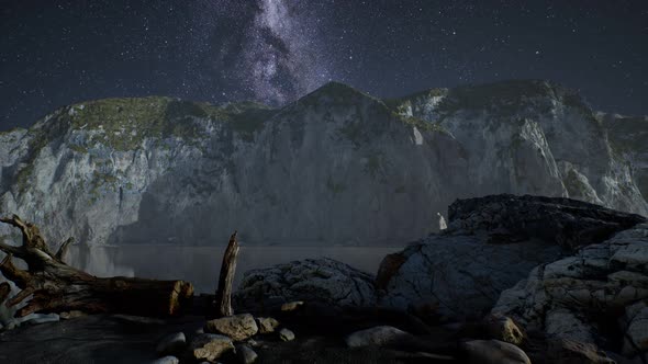 Hyperlapse of Night Starry Sky with Mountain and Ocean Beach in Lofoten Norway