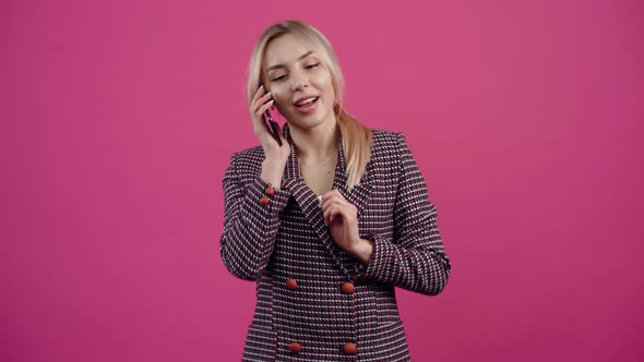 A Young Woman in Love Energetic Speaks on the Phone Who Receives a Very Important Message and is