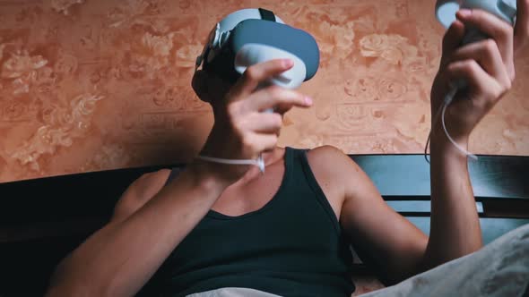 Man in a Virtual Reality Helmet Controls the Controllers