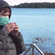 A Lady Holding the Cup of Drink in Finland - VideoHive Item for Sale