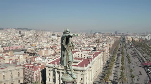 AERIAL: Close Up Circling Columbus Monument in Barcelona, Spain on Beautiful Sunny Day 