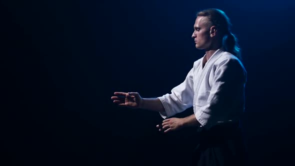 Fight Between Two Aikido Fighters in Dark Studio. Slow Motion. Close Up.