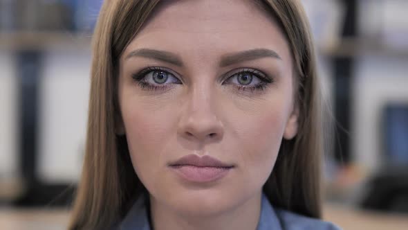 Close Up of Young Girl Face Looking at Camera