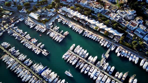 View from drone on full of yachts Bodrum harbour and ancient Kalesi castle in Mugla in Turkey