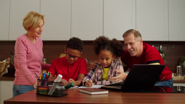 Loving Grandparents and Multiethnic School Age Grandchildren Studying Together