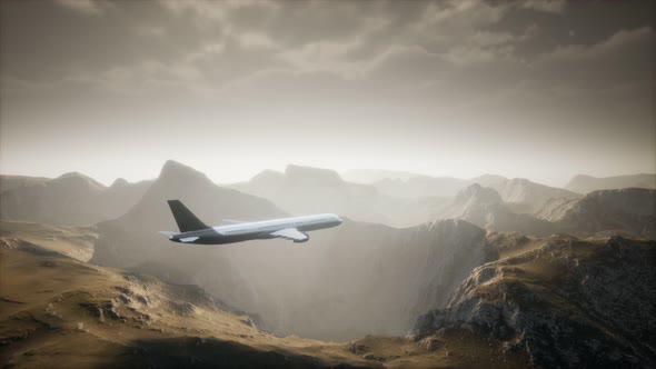 Passenger Aircraft Over Mountain Landscape