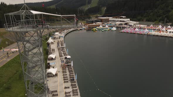 Person jumping from pendulum at Bukovel, Ukraine. Aerial