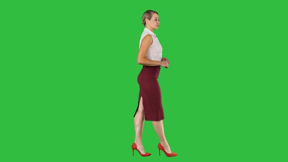 Walking business woman on a Green Screen, Chroma Key