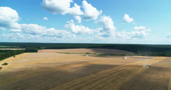 Combines Working Aerial View