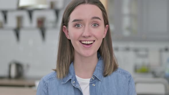 Portrait of Beautiful Young Woman Saying Yes By Head Shake 