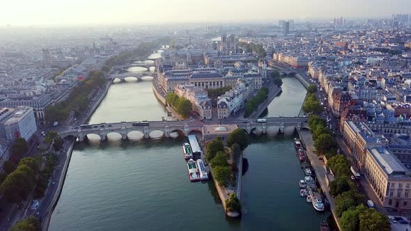 Morning aerial panoramic view on western tip of Ile de la Cite island with traffic on Pont Neuf, Par