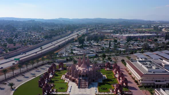 Flying away from the Hindu temple BAPS Shri Swaminarayan Mandir in Southern California
