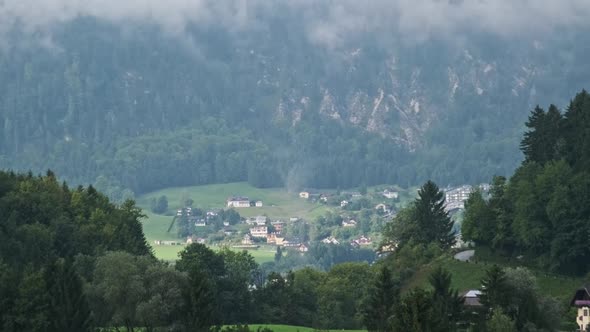 Austrian Rural Landscape with Mountains Houses and Green Lawns