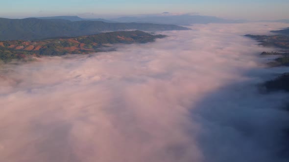 4K Drone Flying through the clouds at dusk or dawn. Aerial top cloudscape