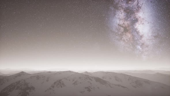 Milky Way Above Snow Covered Terrain alt