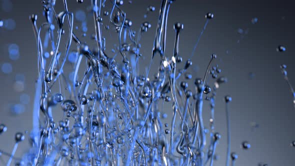 Super Slow Motion Shot of Splashing Blue Liquid on Gradient Background at 1000Fps