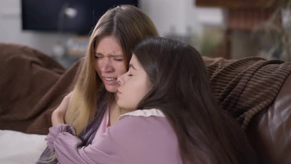 Stressed Depressed Beautiful Young Woman Crying As Empathetic Friend Hugging Calming Down Upset