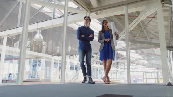 Young man and woman working in a creative office