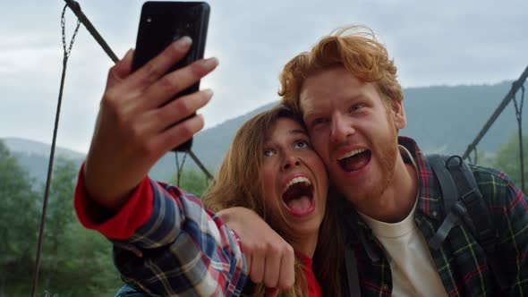 Happy Couple Taking Photo on Mobile Phone