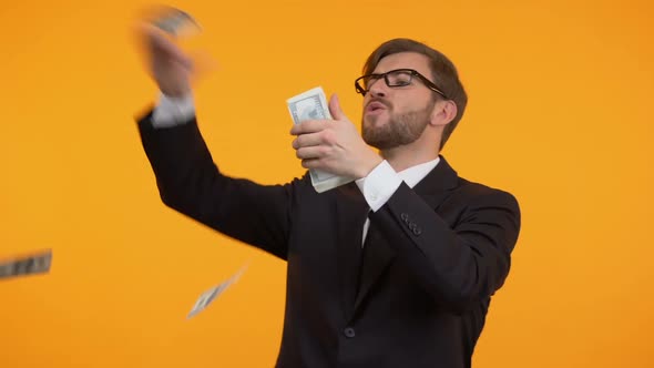 Cheerful Man Throwing Money From Bunch in His Hands, Victory, Big Win, Fortune