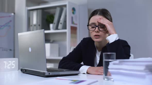 Exhausted Female Office Worker Suffering Headache and Taking Pill Stressful Job