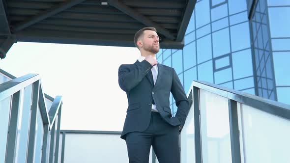 Confident Guy in Leather Shoes and Suit Being on His Way to Office Building