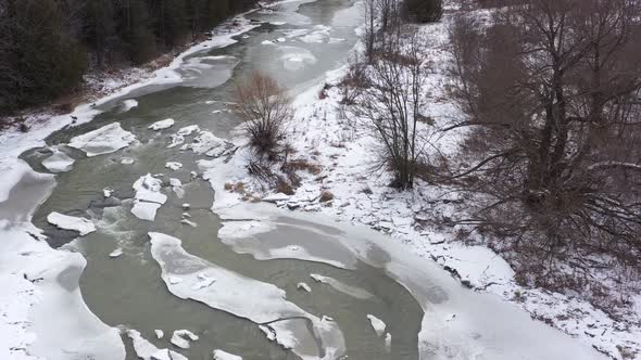 icy winter river overhead twisting beauty with cracked ice