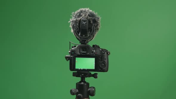 Close Up Hand Male Recording Video With Digital Camera In Green Screen Studio