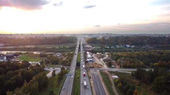 The A1 highway bridge over river Neris in Kaunas, Lithuania in drone aerial time-lapse. Heavy traffi