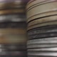 Close movement of the camera to old round metal boxes with film strip in them. Selective focus. - VideoHive Item for Sale