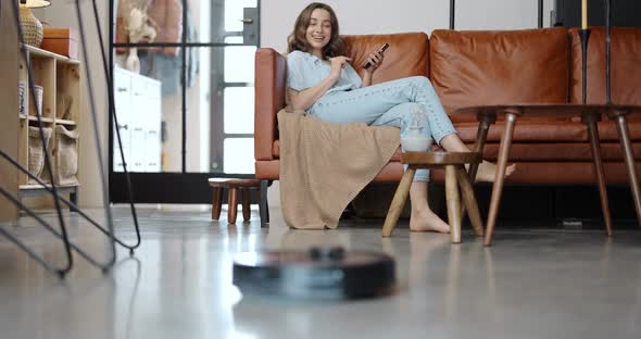 Robot Vacuum Cleaner Cleaning at Home