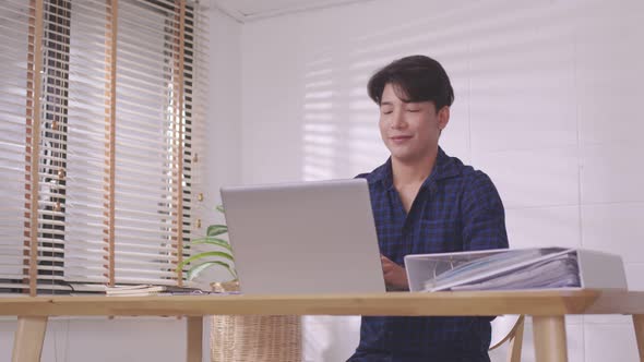 Asian entrepreneur At home, after a long day at the office