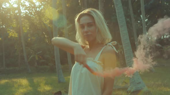 Young Blonde Standing Contemplating Tropical Rainforest Sunset Light Coming From Above