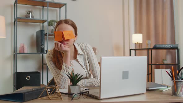 Tired Woman Teacher Using Laptop Computer with Funny Stickers on Eyes Sleeps at Workplace Napping