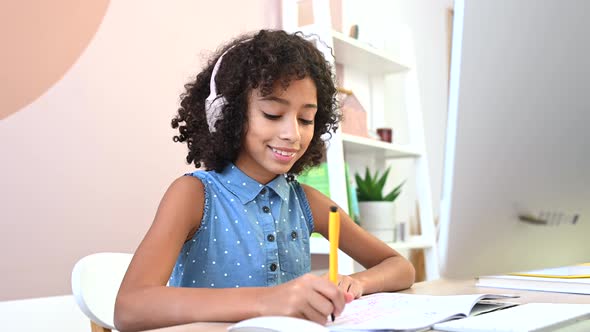 Cute African Girl Is Studying Online