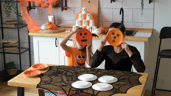 Little Girl with Mother Having Fun in Halloween