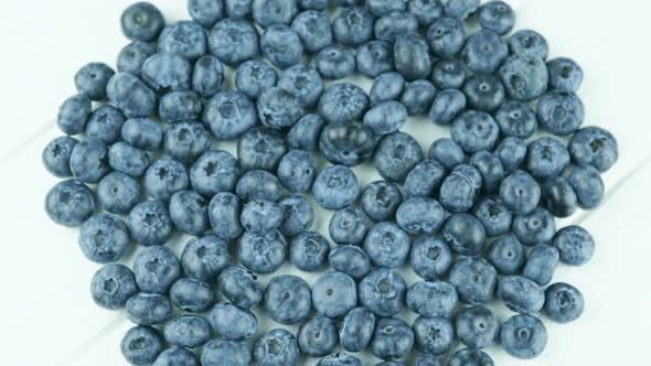 Fast Rotation Of Juicy Blueberries On A White Background.