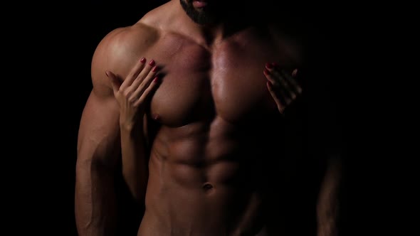 A Woman with Her Hands on a Sexy Muscular Chest of a Man
