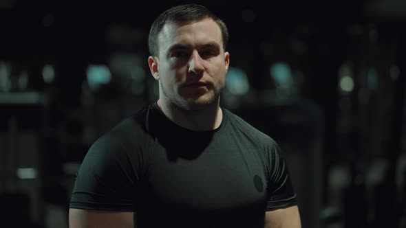 Portrait of Muscular Man in Gym