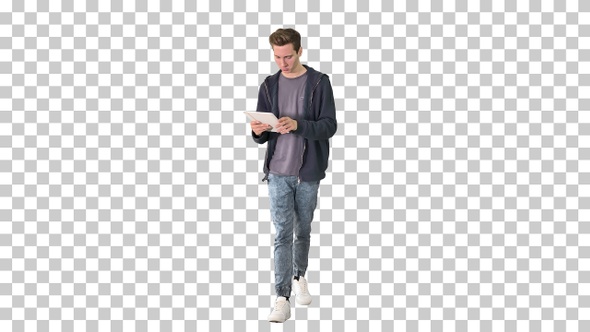 Casual man using tablet while walking, Alpha Channel