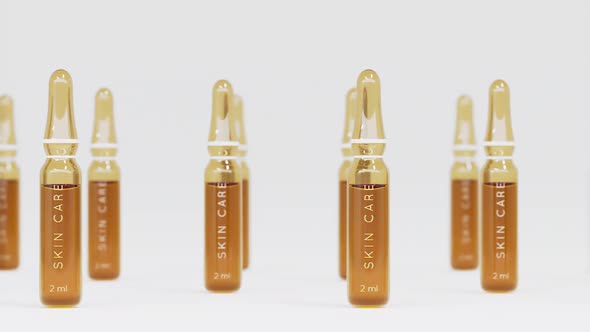 Tracking Shot of Ampoules on White Background with Shallow Dof
