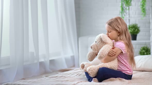 Wistful Girl Embrace Toy Bear Friend Feeling Love and Support