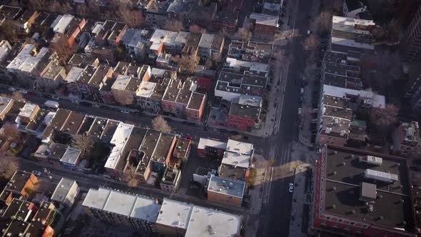 Drone descending over old residential high rise buildings.