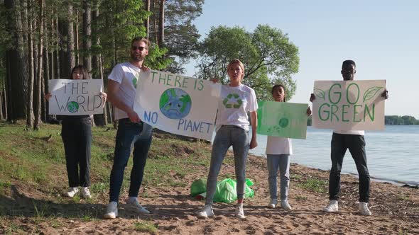 Ecoactivists Fighters with Posters in Their Hands Protest Against the Pollution of Nature a Meeting