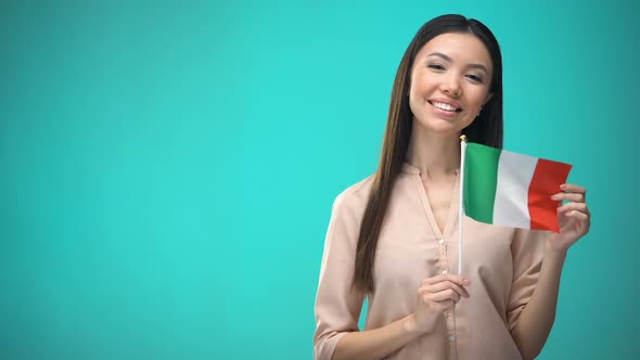 Smiling Lady Holding Italy Flag, Ready to Learn Foreign Language, Italian School