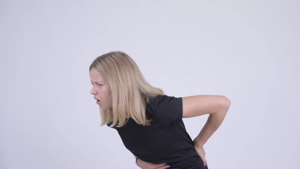 Young Stressed Blonde Woman Having Stomach Ache