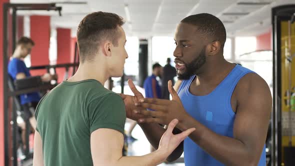 Afro-American Man Proving His Point of View to Caucasian Man, Emotional Disputes