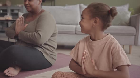 African-American Girl Meditating at Home