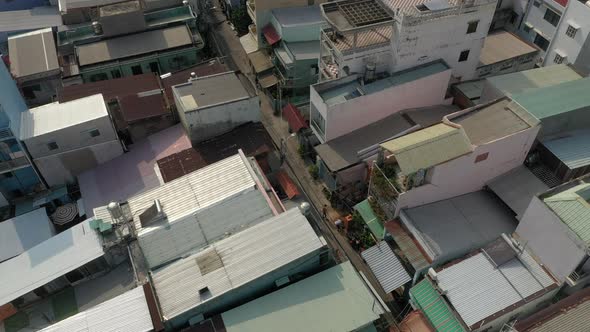 Aerial video of interesting rooftops of quirky high density residential area in Southeast Asia on a