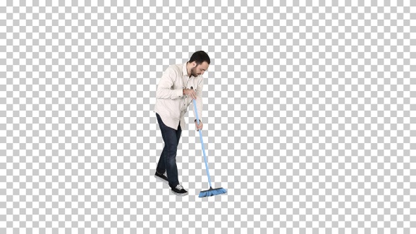 Young man cleaning floor with brush, Alpha Channel